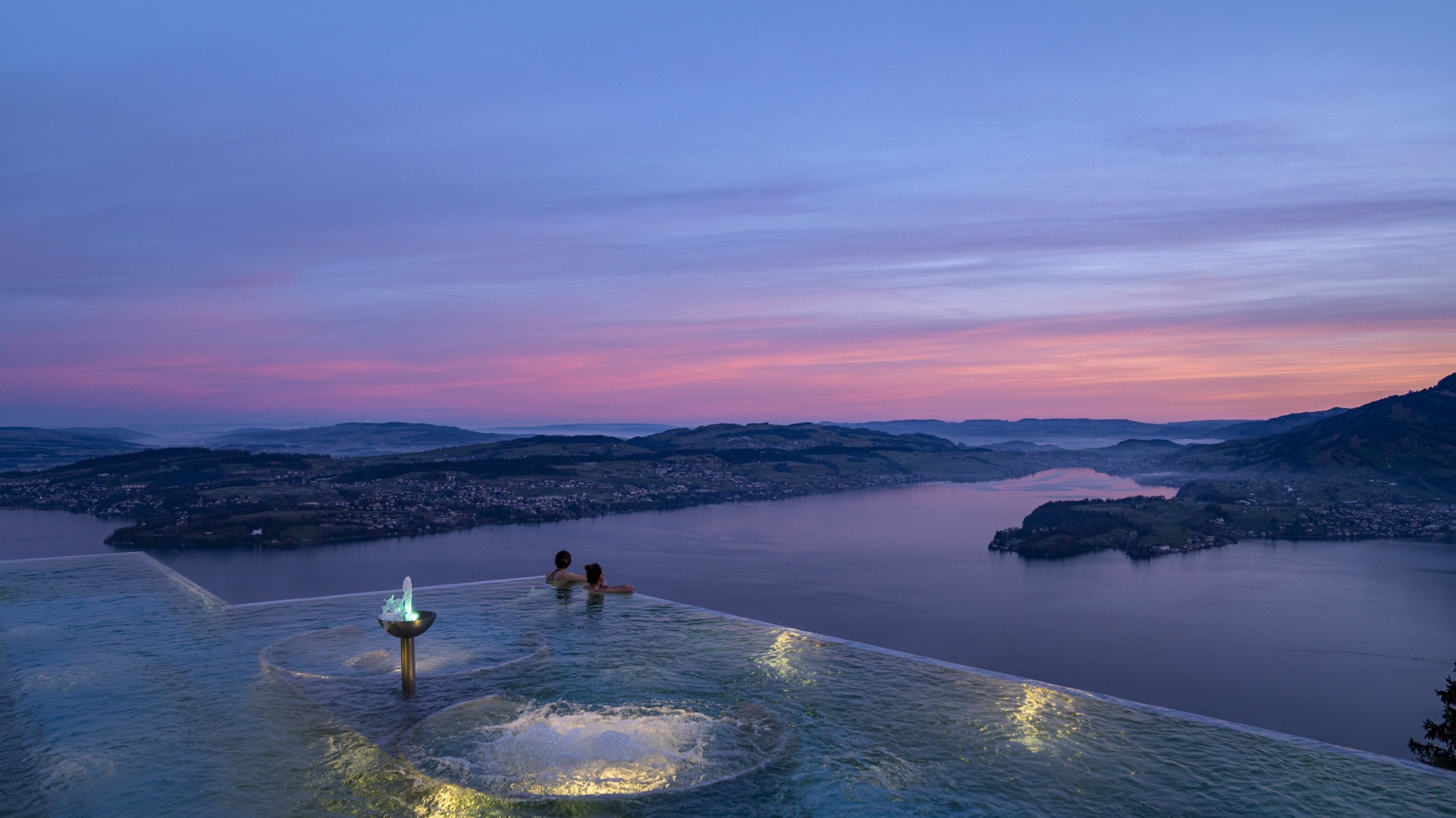 BH_alpine spa_infinity pool_night_lake lucerne_people_01